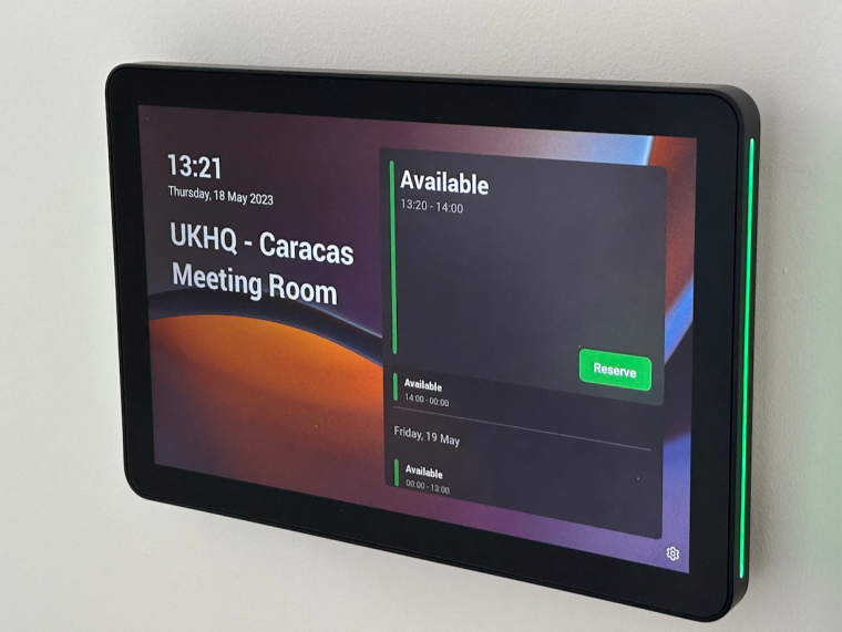 A close up of the logitech meeting room scheduler  indicating that it is available as used for a Desk & Room Booking system