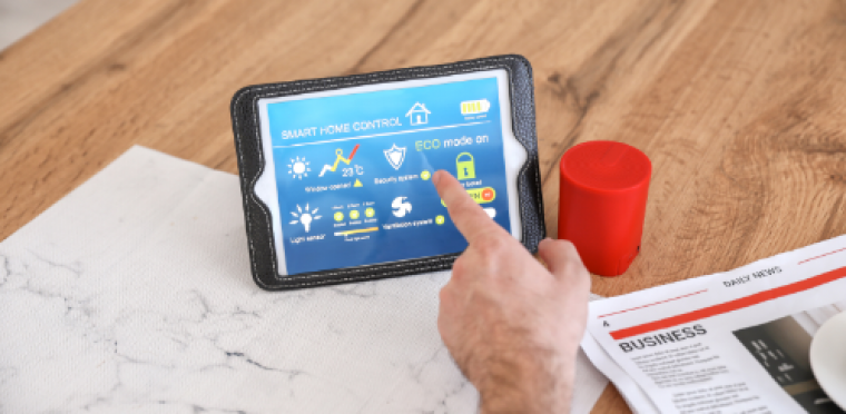 Man touching his Tablet's screen in order to Monitor his Smart Home Security