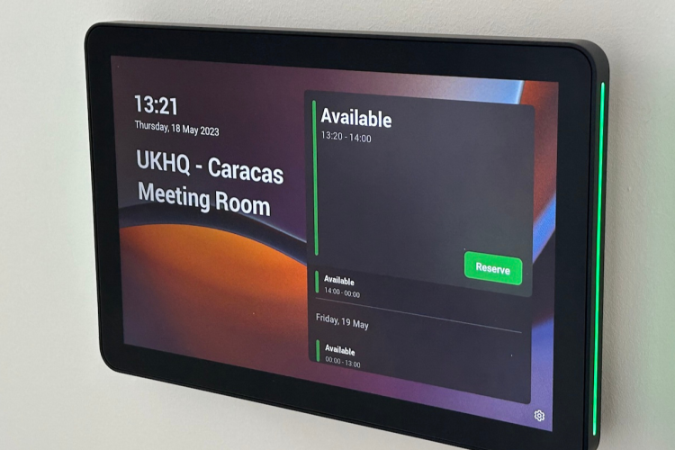 A close up of the logitech meeting room scheduler  indicating that it is available as used for a Desk & Room Booking system